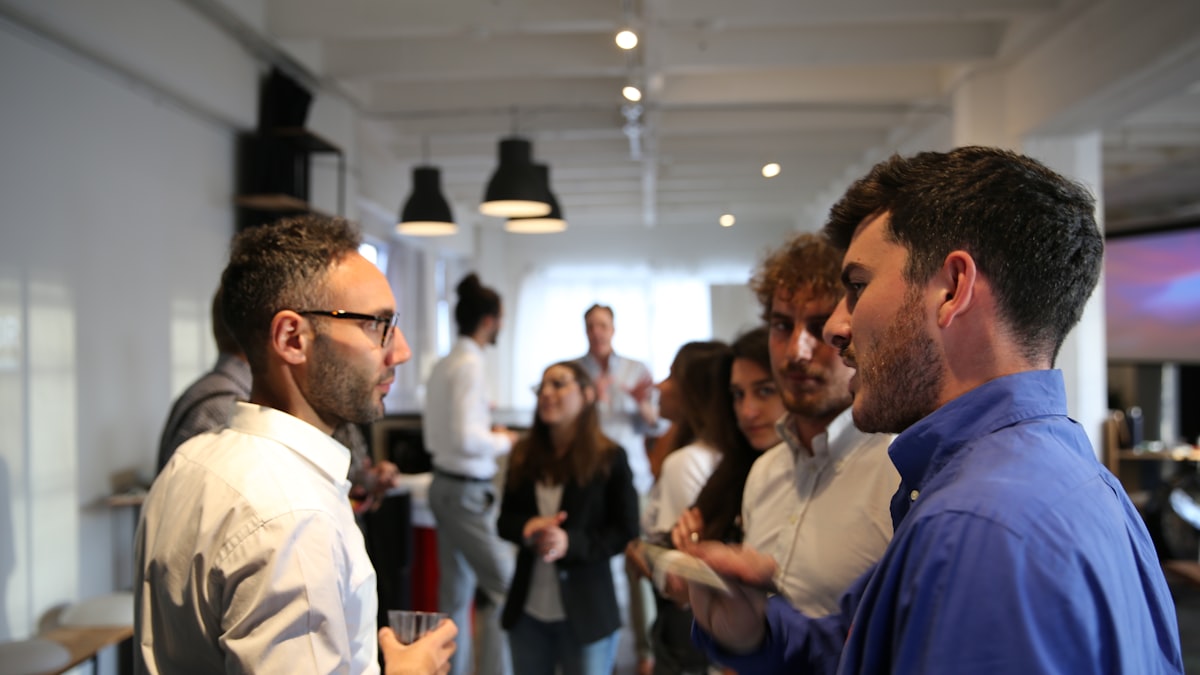 5 Benefits of a Trading Community — a group of people standing in a room