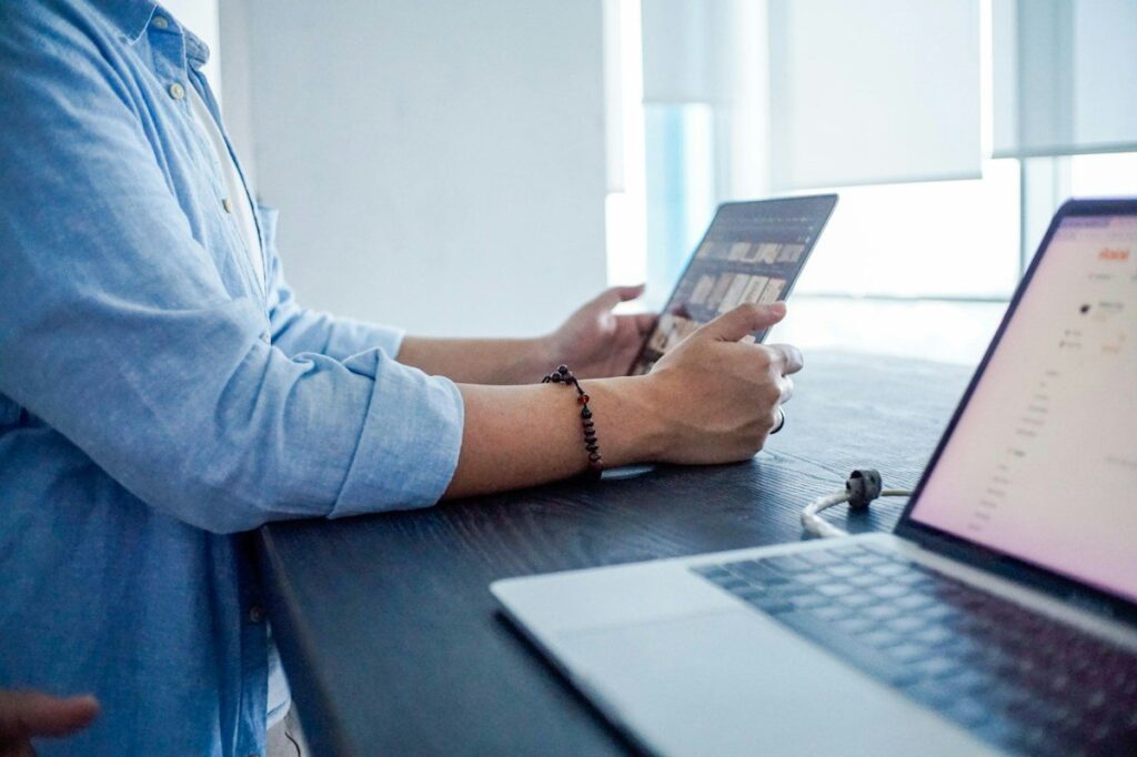 Trader checking yesterday's value area on a tablet before using market profile with price action