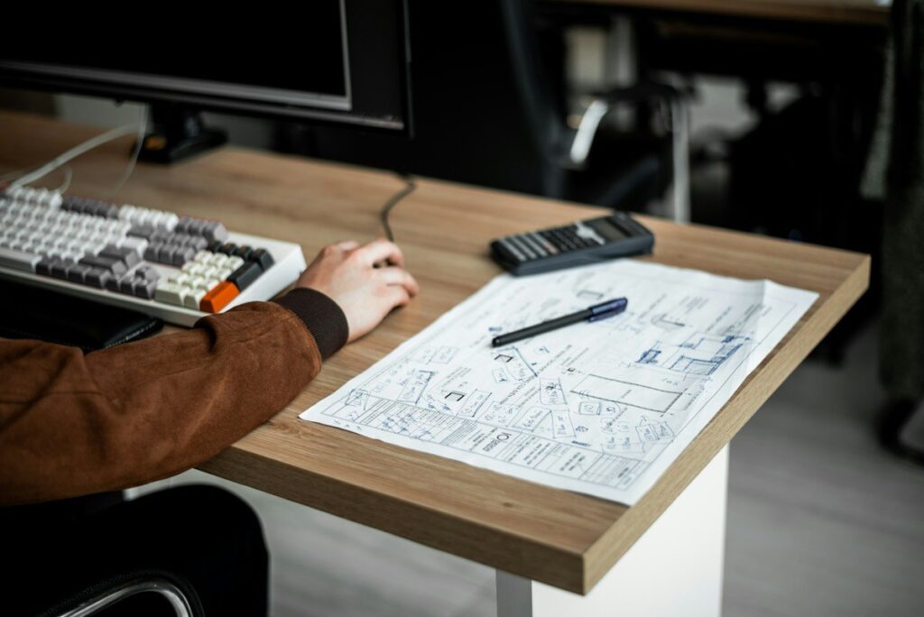 Architect drawing with a ruler, like marking the edges of a supply and demand zone on gold