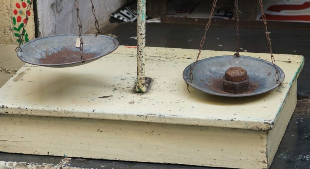 Old balance scales, illustrating balance and imbalance in market profile shapes