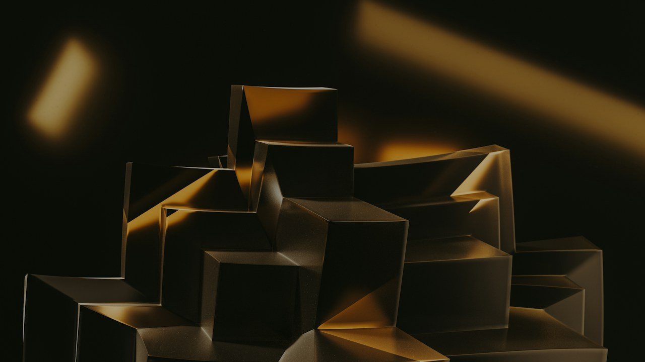 Abstract gold blocks on a dark background, illustrating the best time to trade gold in the UK