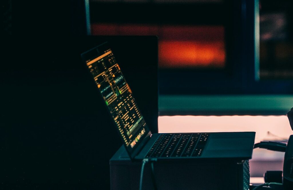 Laptop showing a chart in a dark room