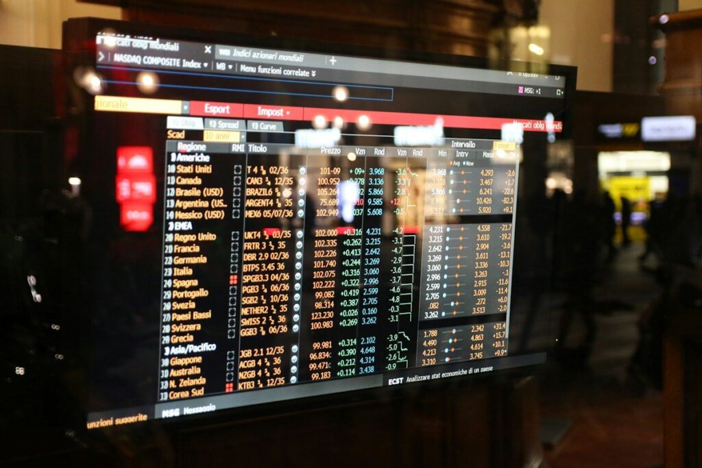Screen listing market prices in a dark room