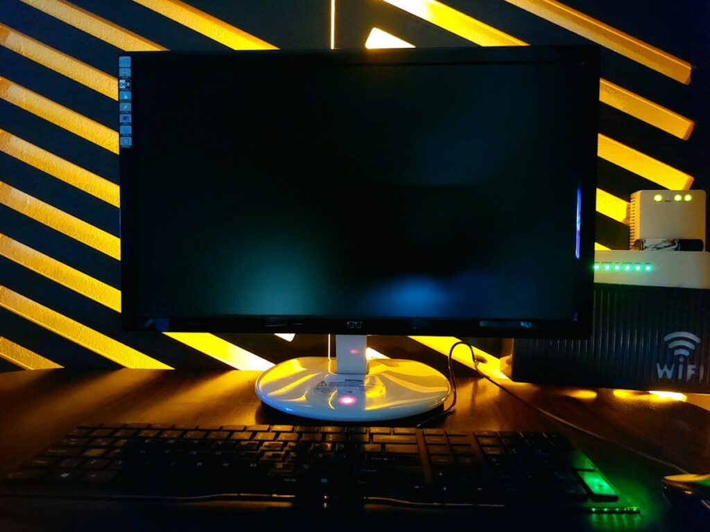 Dark monitor and keyboard at a trading desk, where a daily loss limit stops emotional trading