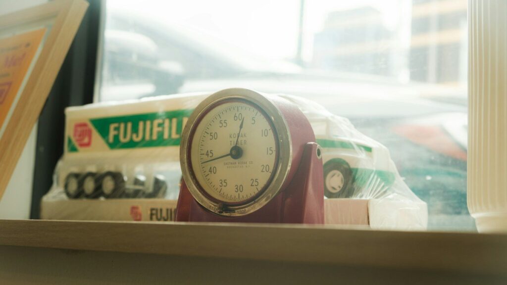 Small clock on a windowsill, a reminder to wait for the engulfing candle to close before entering