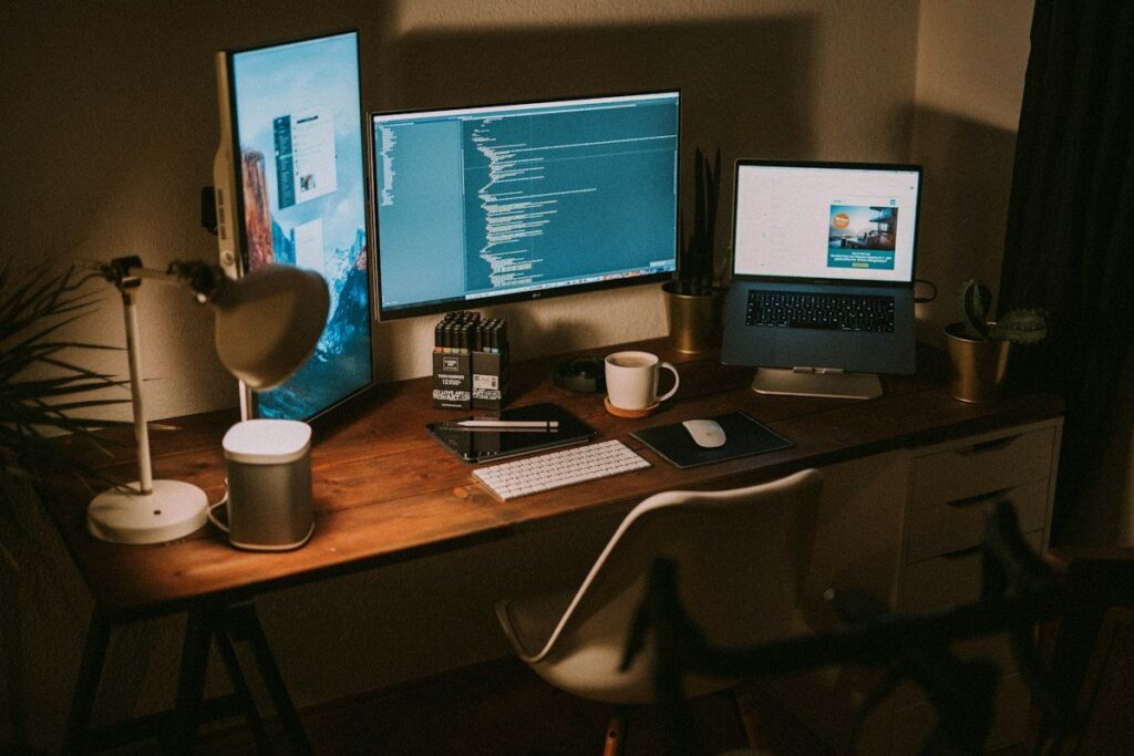 Desk with two screens set up for checking that two timeframes agree on the start of a new trend