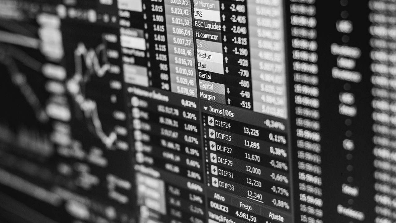 Black and white screen of share prices and figures
