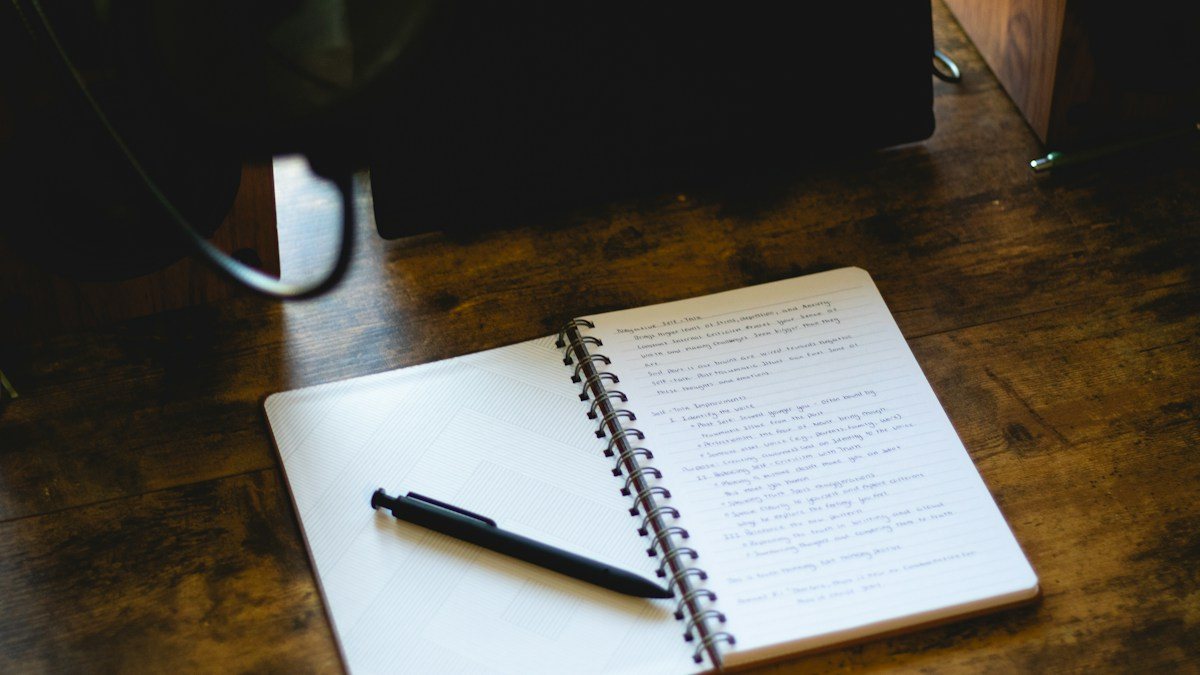 Handwritten trade entry checklist in a notebook, with filters and triggers ticked off one by one