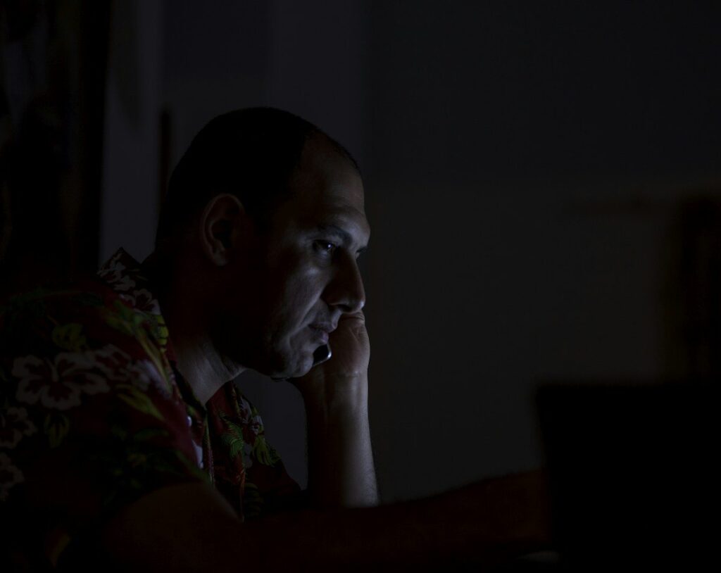 Frustrated trader at a laptop after common price action trading mistakes