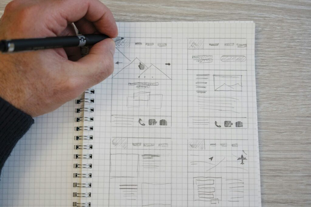 Hand sketching range boxes in a notebook to mark levels and the no-trade middle of a range
