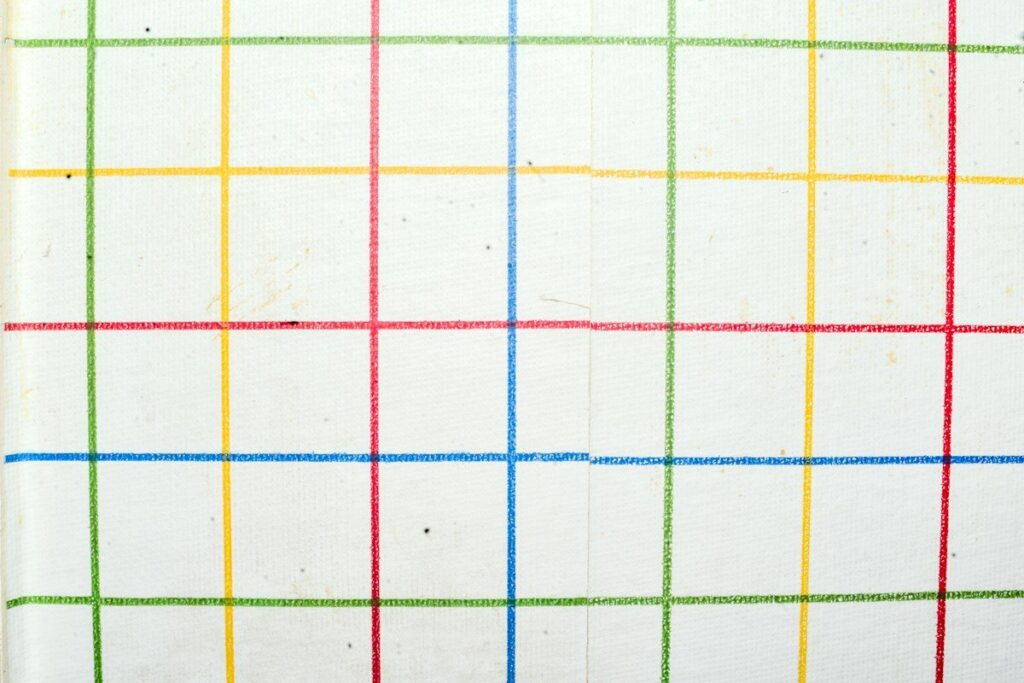 Coloured grid lines on paper, like the range edges of a failed breakout price action setup