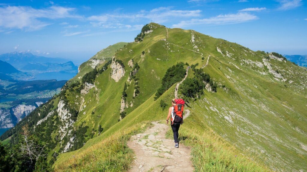 Hikers on a switchback mountain path, like Bitcoin swing highs and lows forming market structure