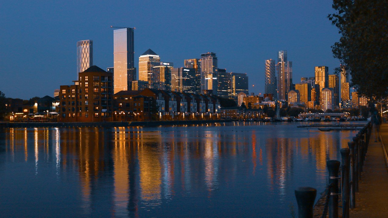 Office towers at Canary Wharf at dusk, a London backdrop for a guide to trading stock indices from the UK