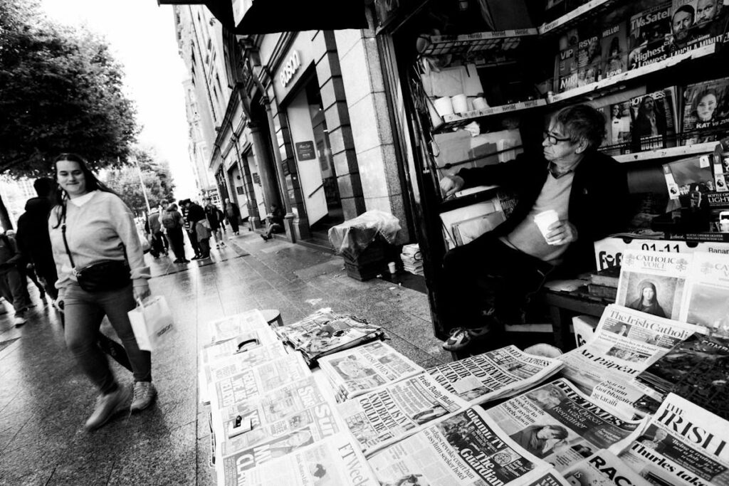 Street newspaper stand in the morning, a reminder that US news can create or break gold zones