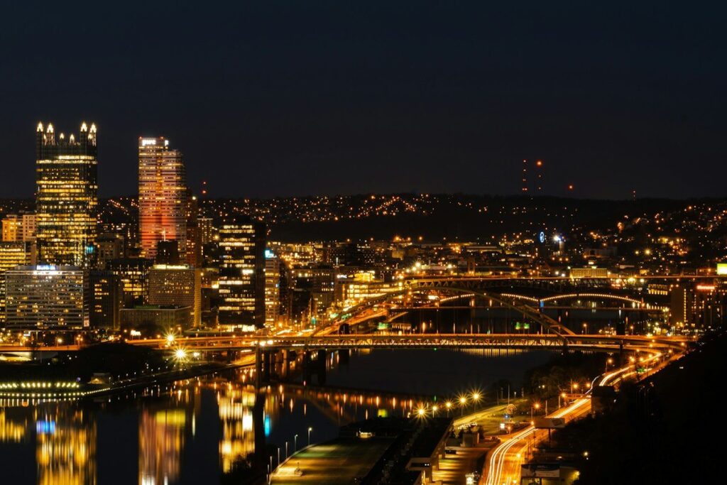 City skyline lit up at night, a reminder that the crypto market keeps trading around the clock