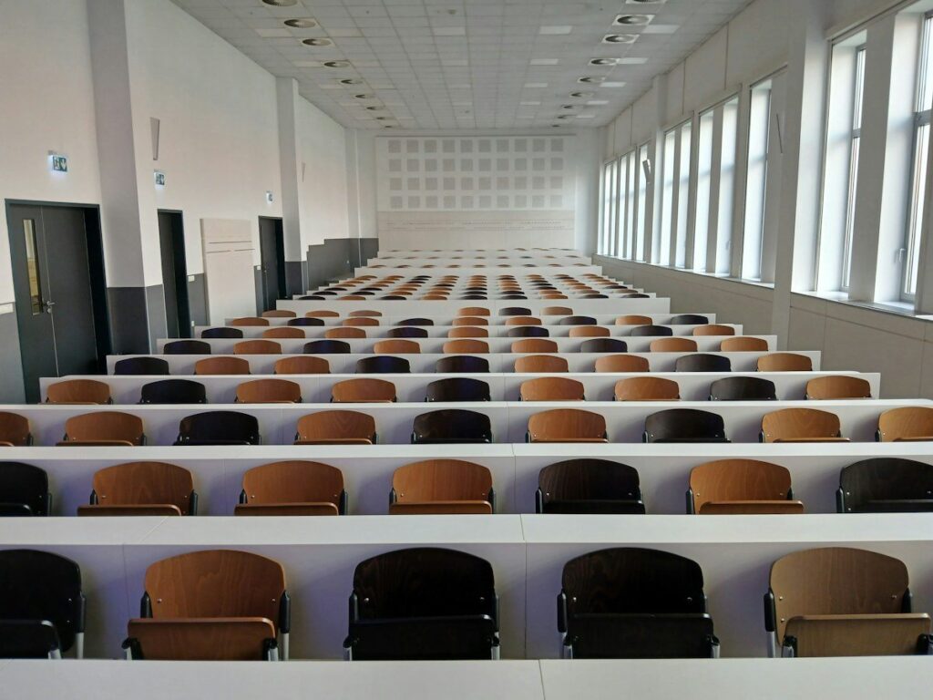 Empty tiered lecture hall, a nod to the trading pit history behind market profile day types