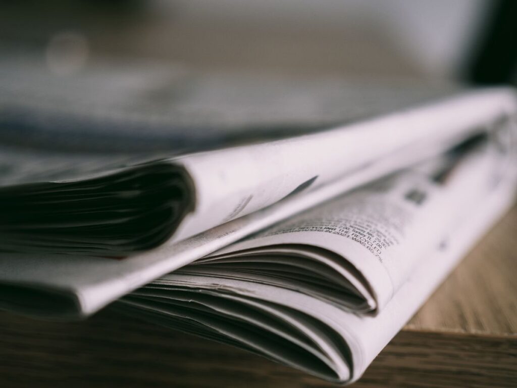 Folded newspapers on a table