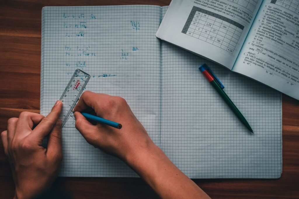 Pencil and ruler on graph paper, used to measure the distance from entry to a buffered stop