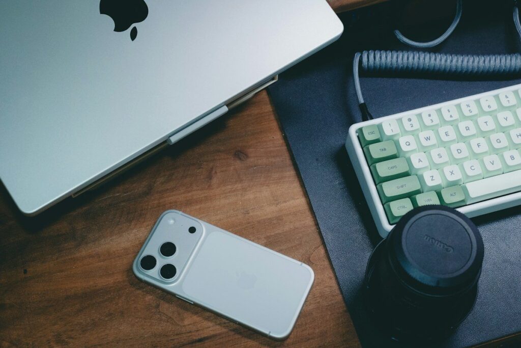 Phone and keyboard on a wooden desk