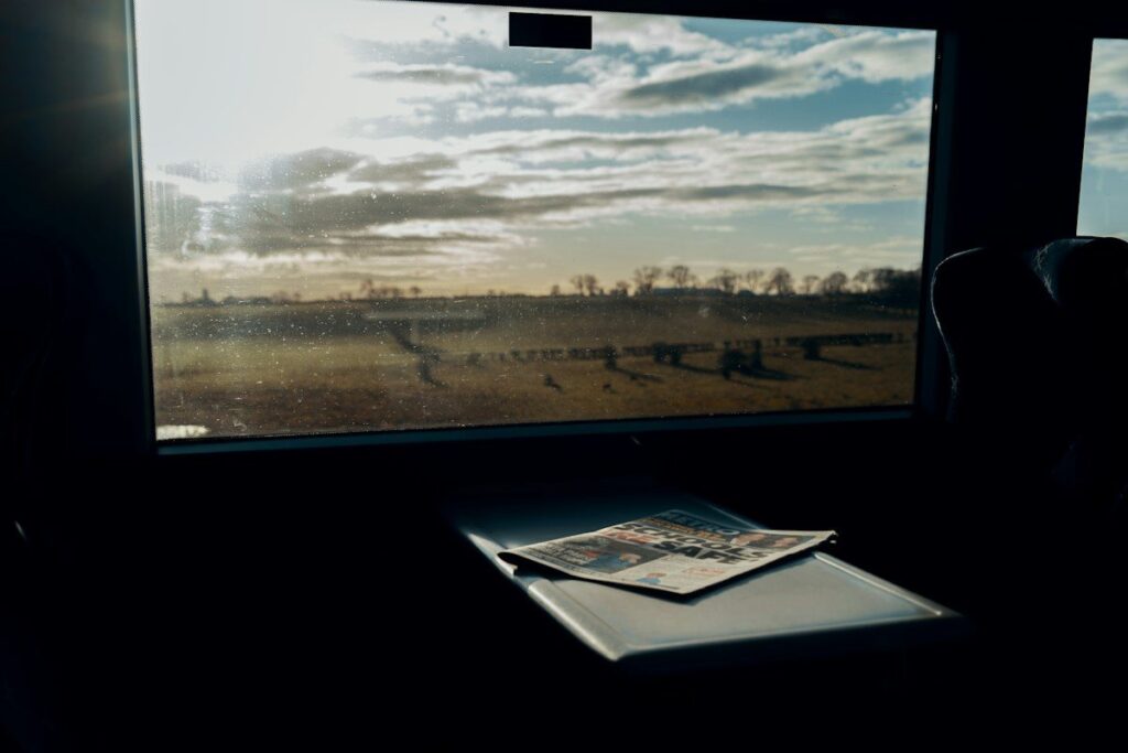 Notes on a desk by a window at dusk, planning a hypothetical trade from a gold demand zone