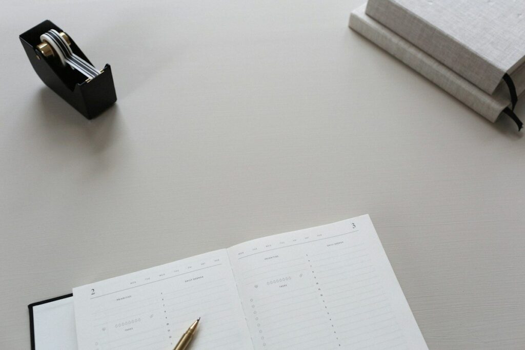 Printed pages and a pen on a desk, like a trading course syllabus checked before paying