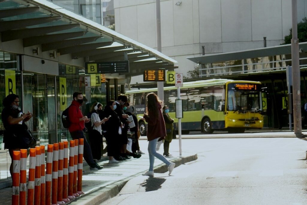 People gathered at a bus station, like stop-loss orders lined up just beyond a round number