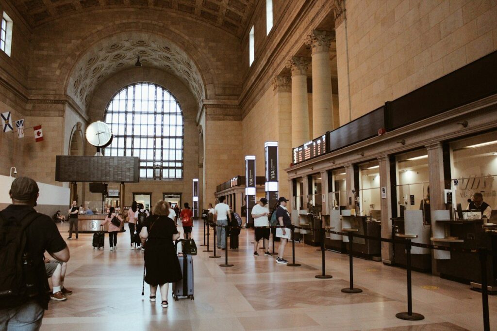 People queuing at a counter, like orders waiting at a support level or inside a demand zone