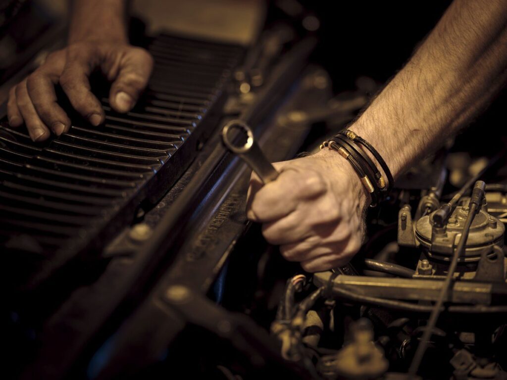 Hand turning a spanner on an engine, a picture of a stop that only ever moves one way