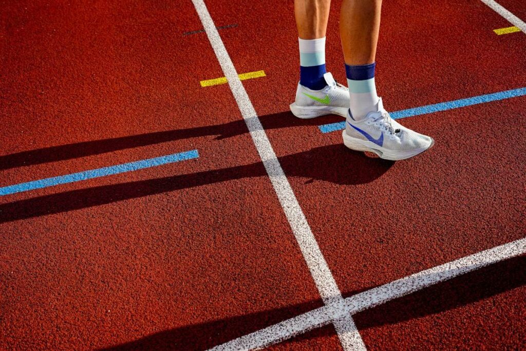 Runner's feet on an athletics track, a picture of price stalling just before the profit target