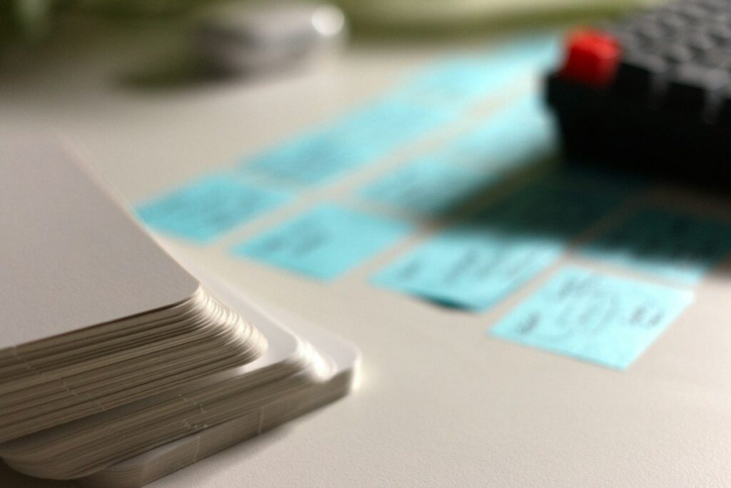 Hand sorting index cards into rows, like grouping sessions into market profile day types