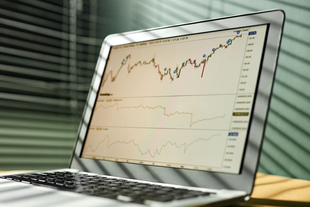 Desktop monitor in a trading room showing candles turning higher after a decline