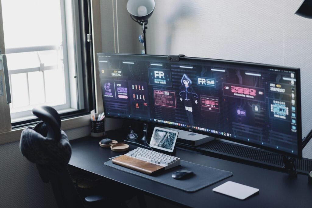 Ultrawide monitor with dashboards on a home desk