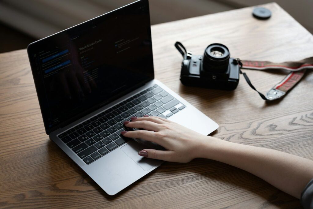 Hands on a laptop keyboard after exiting a failed retest that closed back through the zone