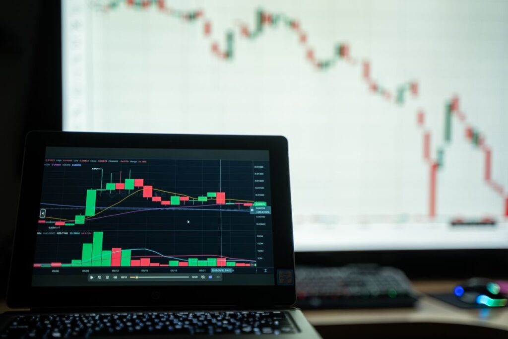 Forex charts on several monitors at night