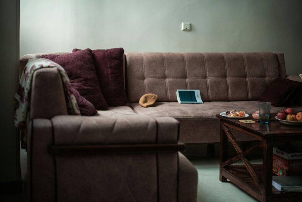 Sofa at home with a tablet on the cushion, ready for reviewing past engulfing candle setups