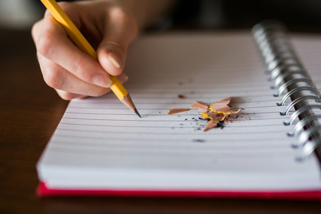 Trader sketching market highs and lows in a notebook to explain what price action trading is
