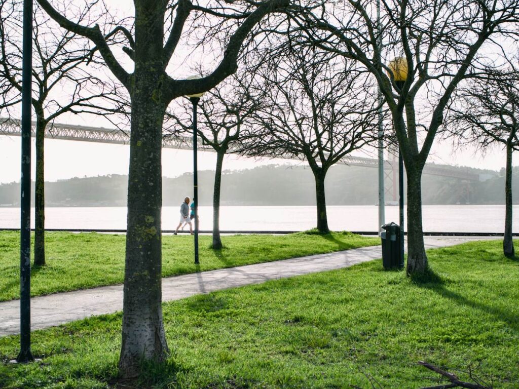 Trader walking by a river after hitting a loss limit, stepping away to stop emotional trading