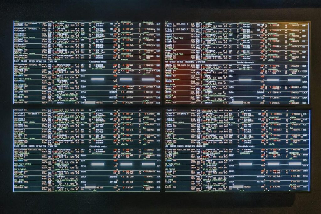 Wall of screens showing rows of prices