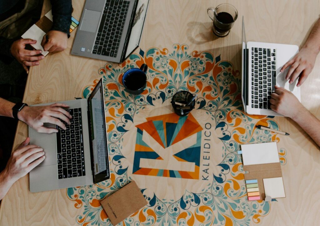Group working on laptops around a table