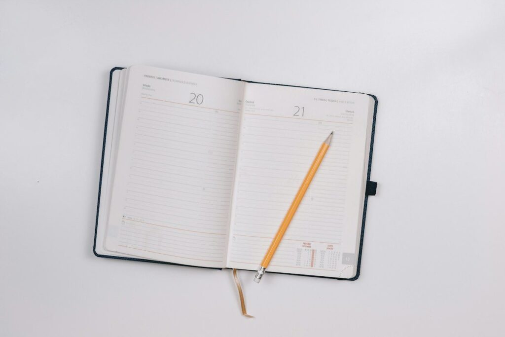 Open diary with a pencil, ready for grading each price action setup for later review