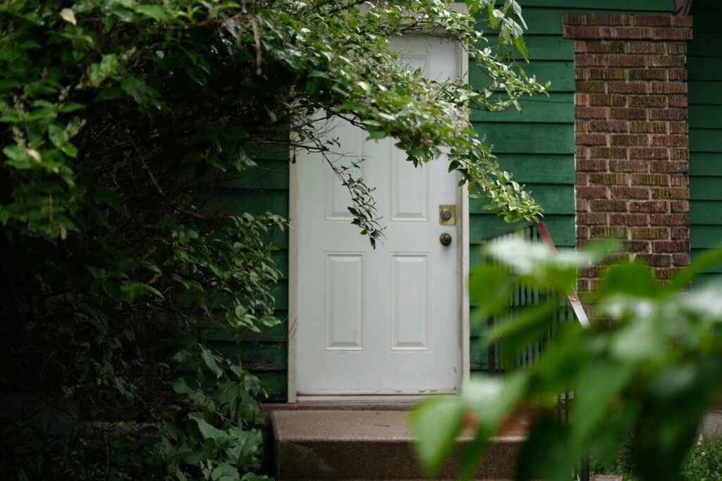 Closed front door of a house, a reminder to plan for a failed double top before entering